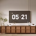 Wooden TV Stand With Drawers And Decorations Near Potted Plant On Striped Wall