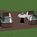 Stylish Outdoor Sofa With Black Rattan Frame Green Cushions And Side Table On Wooden Deck