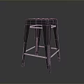 Black Metal Stool With Four Legs And Crossbar On Dark Reflective Surface