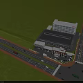 Aerial View Industrial Factory Building With Surrounding Roads Vehicles Red Soil Hills And Distant Mountains