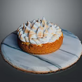 Delicious Golden Cake With Fluffy Meringue Topping On Marble Serving Tray