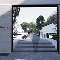 Modern Courtyard Garden Entrance Featuring Gray Walls Brick Pavement Green Plants and Sunshade