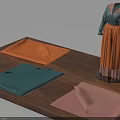 Clothing Mannequin in Green Top and Orange Skirt with Folded Fabrics on Display Platform