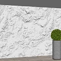 White Textured Background Wall with 3D Relief Design Illuminated by Side Lighting and Silver Planter 3d model