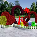 Creative Bush Sculptures Featuring Heart Shapes Red Figures and LOVE Letters in Park