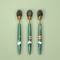 Cosmetic Makeup Brushes With Green Handles Gold Metal Parts And Black Brush Heads