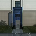 Modern Building Exterior Design With Transparent Glass Elevator And Grass Shrubs