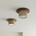 Two Modern Ceiling Lights With Wooden Base And Textured Shade On White Ceiling