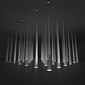Immersive Art Installation Featuring Tall White Columns Circular Floor Lights And Person With Outstretched Arms