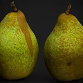 Two Ripe Pears With Green Yellow Skin And Brown Speckles On Dark Background