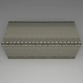 Gray Brick Building Exterior Wall With Top Decorative Details And Traditional Architectural Design