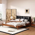 Double Bed With Black Leather Headboard Wooden Frame Patterned Bedding Nightstand Lamp And Decorative Screen