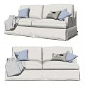 White Two Seater Sofa Featuring Plaid And Decorative Pillows With Folded Blanket