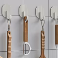 White Hooks Mounted On Tile Wall Holding Kitchen Utensils 3d model