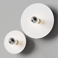 Modern White Round Wall Lamps With Transparent Bulbs Mounted On Gray Wall Emit Soft Light