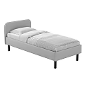 Modern Single Bed With Upholstered Headboard Light Gray Frame White Pillows And Striped Blanket