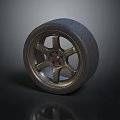 Stylish Tire with Golden Five Spoke Rim Red Center and Tread Pattern on Dark Background