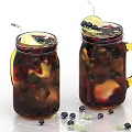 Cold Refreshing Berry Drink in Mason Jars with Ice Blueberries Lemon Slices and Mint