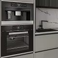 Modern Kitchen Interior Featuring Gray Black Cabinets Marble Countertop And Built In Ovens