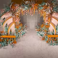 Wedding Photo Spot With Elaborate Flower Arch Orange Pink Green Decor Railings And Grid Background