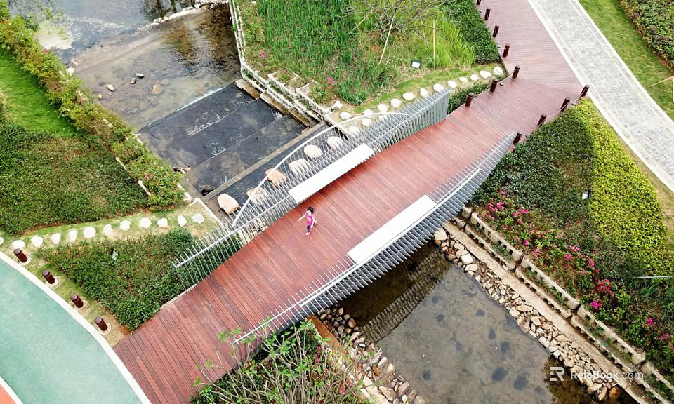 Wooden Landscape Bridge Spanning Stream With Green Vegetation And Paved Walkway 3d model 