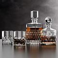 Elegant Glass Decanters And Whiskey Glasses With Amber Liquid And Ice Cubes On Dark Table