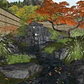 Japanese Garden Water Fountain With Stream Stones Bamboo Fence Greenery And Red Maple Tree