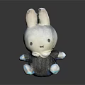 White Rabbit Toy With Gray Outfit And Bow Tie Sitting On Black Background