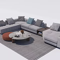 Modern L-shaped Sofa With Multiple Pillows And Round Coffee Table Set On Gray Rug 3d model