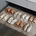 Soft Various Colored Slippers in Different Styles Arranged on Home Carpet