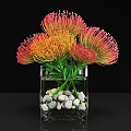 Clear Square Glass Vase With Vibrant Orange And Pink Flowers And Decorative Pebbles