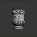 Ceramic Sculpture Vessel Featuring Carved Floral Patterns And Blue White Design