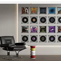 Neatly Arranged Digital Smartphones Wall Display With Accessories Near Leather Chair