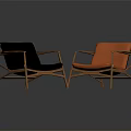 Two Stylish Modern Accent Chairs With Black And Orange Cushions And Wooden Frames