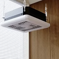 Ceiling Mounted Air Conditioner Fan In Indoor Space With Wooden Wall And Window Blinds