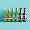 Different Colored Beer Bottles Neatly Arranged in a Row on Light Blue Background