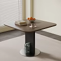 Modern Dark Dining Table With Marble Base Books Bowl Of Oranges And Coffee Cup In Light Room
