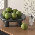 Fresh Green Limes Arranged On Black Stone Tray With Glass Cup And Geometric Wall Art