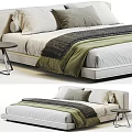 Modern Double Bed With Gray And Green Blanket And Pillows And Side Table