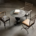Modern Round Metal Table With Books And Three Chairs Featuring Checkered Beige Seats