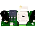 Electronic Circuit Board With Green PCB Black Capacitors And White Components