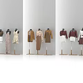 Fashion Mannequins Showcasing Various Clothing Styles in Beige Brown and Burgundy Outfits