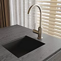 Modern Kitchen Countertop With Brushed Nickel Faucet And Black Sink