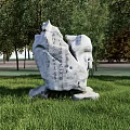 Outdoor Rockery Stone With Chinese Inscriptions Surrounded By Green Grass And Trees