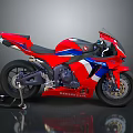 Red Honda Sport Motorcycle With Blue And White Stripes And Sleek Design