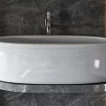 Modern White Freestanding Bathtub With Gray Marble Wall And Metal Faucet Design