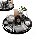 Elegant Bathroom Accessories On Black Tray With Silver Container Brush Candle Towel And Green Leaves