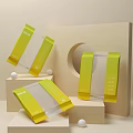 Yellow Transparent Packaging Bags on Beige Geometric Display Stands with White Small Balls