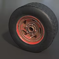 Car Tire With Black Tread Red Rim And Detailed Metal Texture Design