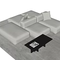 Beige Modular Sofa And Black Coffee Table Set With Cushions On Light Rug